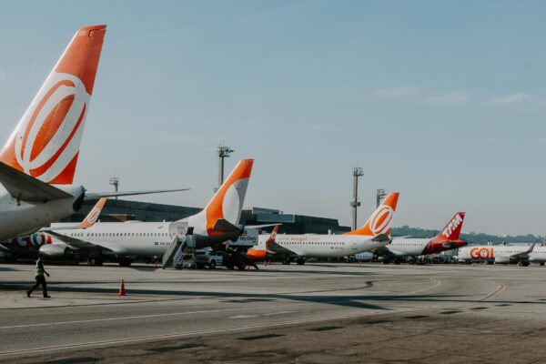 Airplanes parked infront of terminals