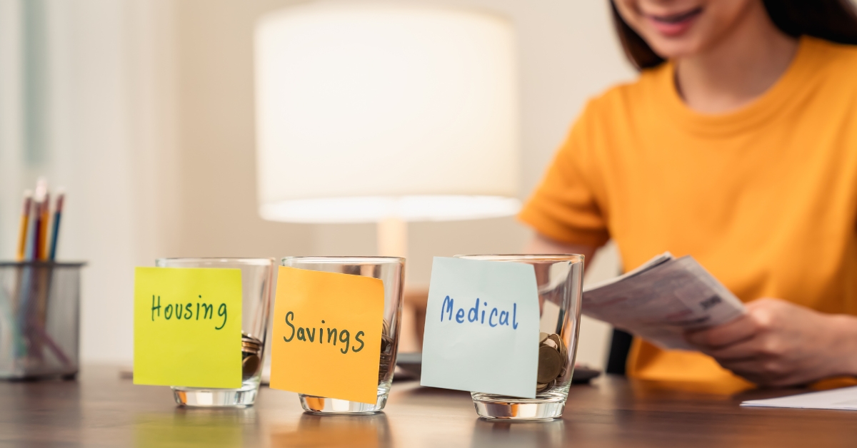 Savings cups with coins in them